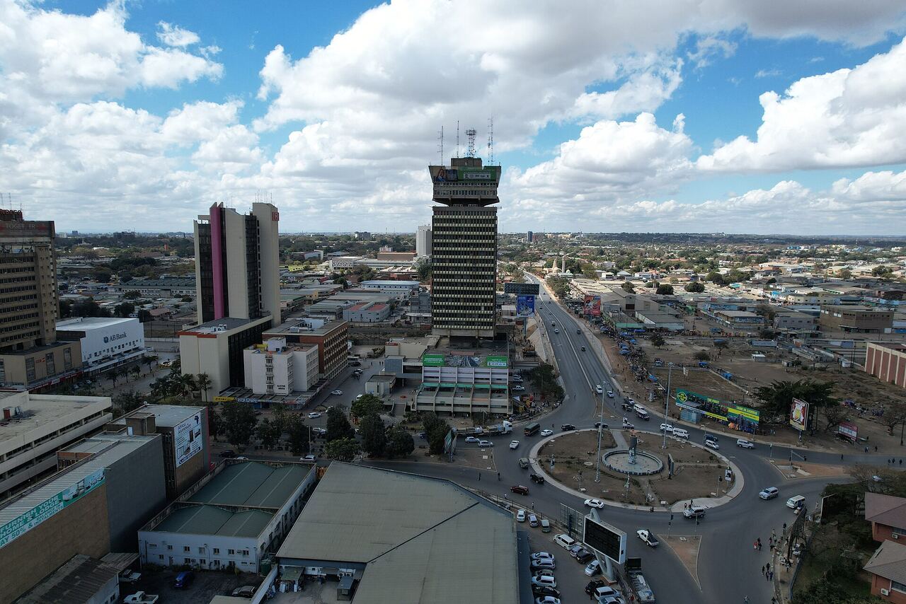 Aerial view over central Lusaka, looking across the Kafue roundabout towards the city skyline